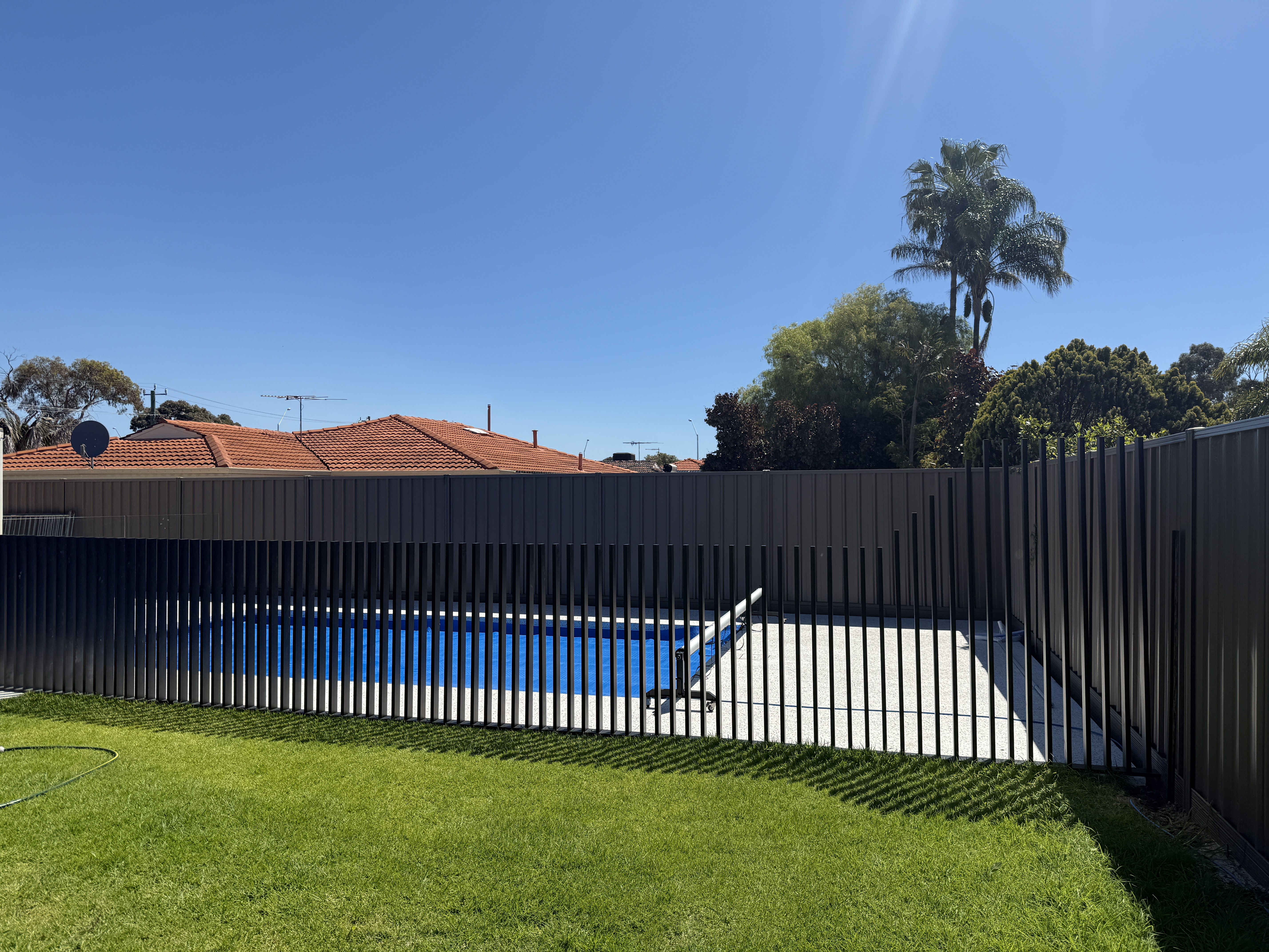 Monument pool fence viewed from garden